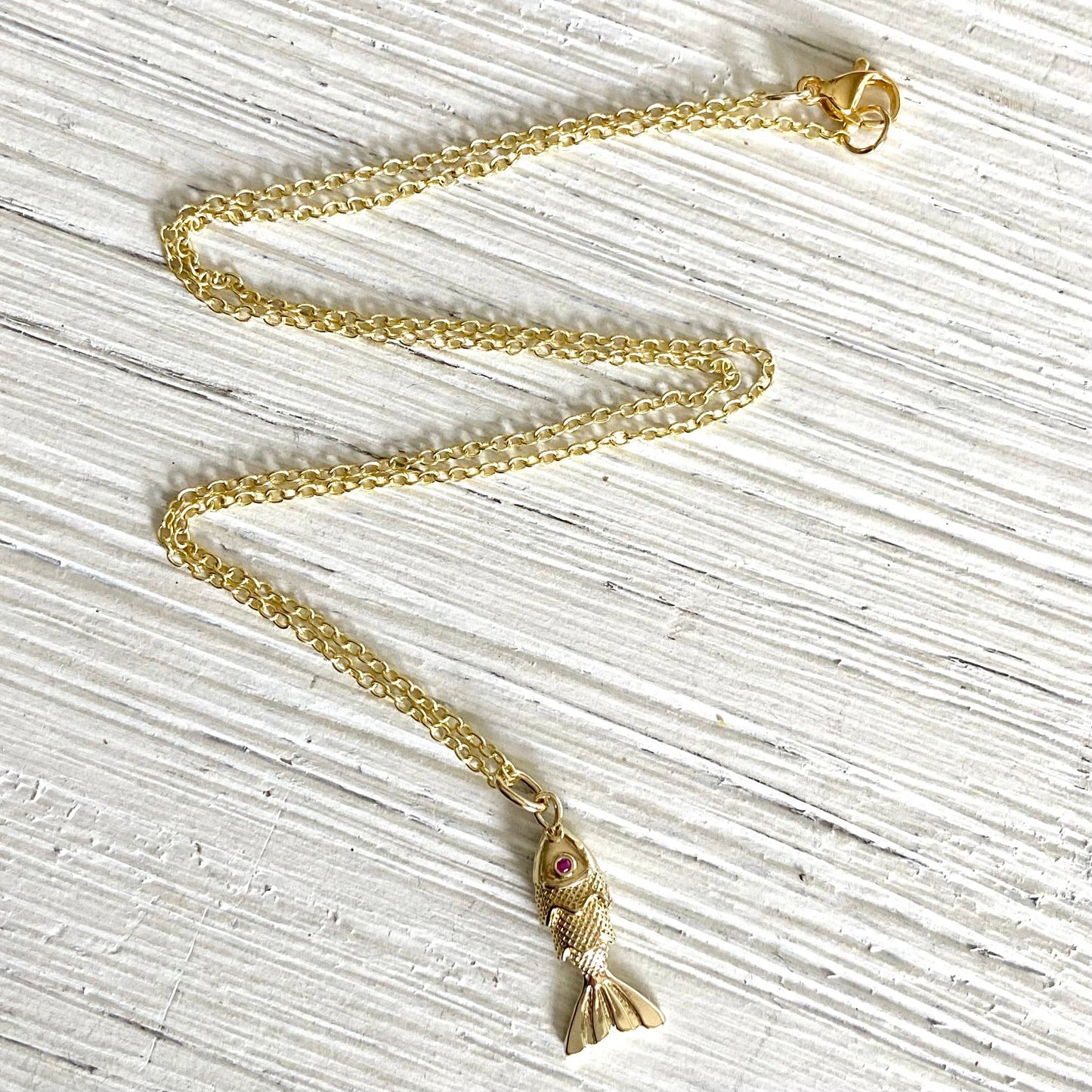 Gold fish necklace charm ruby eyes